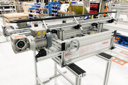 How We Created an Adjustable Conveyor System For a Multi-sized Bottling System